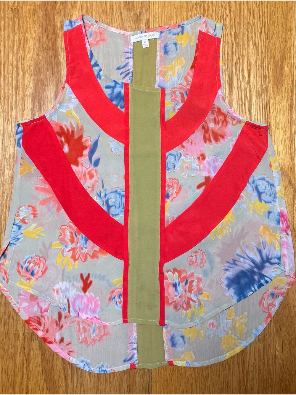 Sleeveless Floral Blouse with Red Accents and Olive Center